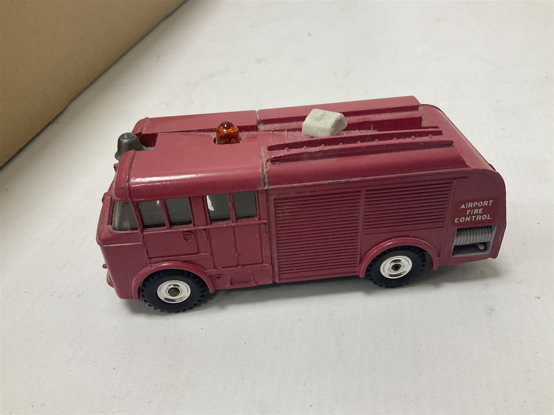Quantity of boxed and loose die-cast cars to include a Dinky Fire Engine, Burago, Matchbox, Lledo etc in two boxes 