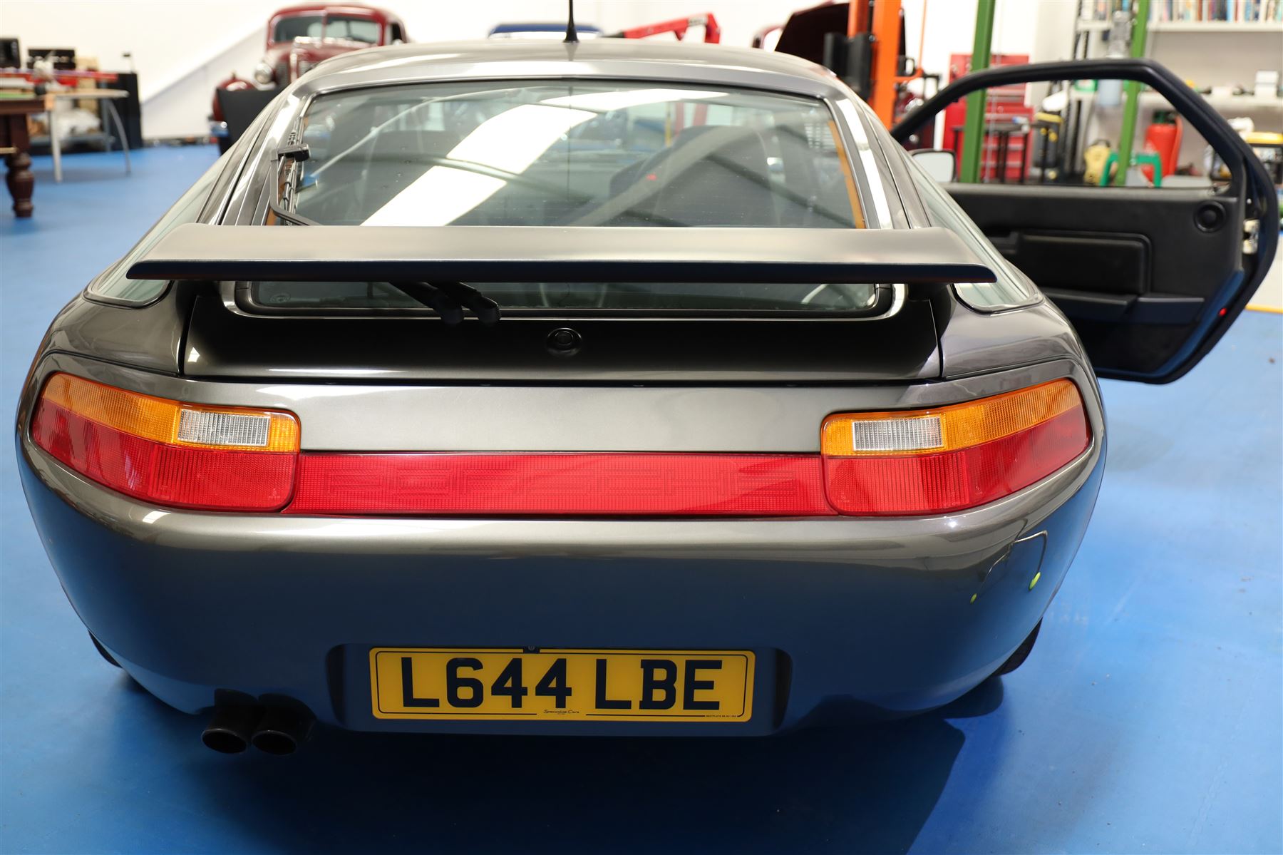 1991 Porsche 928 S4 Automatic Coupé

Registration: L644 LBE
Date of first registration as shown on V5: 1 July 1994
Porsche year of manufacture: 1991
Engine: 5.0-litre V8 petrol
Transmission: Automatic
Odometer reading: 37,886 kilometres (approximately 23,541 miles)
Colour: Slate Grey metallic
Interior: Black leather
V5C: Present
Keys: One
Chassis number: WP0ZZZ92ZMS800460

An exceptional Porsche 928 S4 Automatic Coupé finished in Slate Grey metallic with a black leather interior. The car displays a notably low odometer reading of just 37,886 kilometres, equivalent to approximately 23,541 miles.

The 928 S4 combined Porsche’s powerful 5.0-litre V8 engine with a sophisticated rear-mounted transaxle, creating a refined and accomplished grand tourer. This example is equipped with automatic transmission, electrically adjustable front seats, air conditioning, alloy wheels and the characteristic rear spoiler.

The car was purchased from Specialist Cars of Malton in June 2019, at which time the recorded mileage was 36,650 kilometres. The accompanying service record includes evidence of a cam belt replacement.

Presented in excellent condition throughout, the bodywork and metallic paint finish appear particularly well preserved, while the cabin retains its original character with black leather upholstery and 928-branded sill trims. A Japanese Porsche service label records maintenance entries at 31,902, 33,397 and 34,134 kilometres.

The car also features a Porsche Classic Communications Management (PCCM) upgrade system.

Features

• 5.0-litre V8 petrol engine
• Automatic transmission
• Slate Grey metallic paintwork
• Black leather interior
• Electrically adjustable front seats
• Air conditioning
• Porsche alloy wheels
• Rear spoiler
• Right-hand drive
• Odometer reading of 37,886 kilometres, approximately 23,541 miles
• Purchased from Specialist Cars of Malton in June 2019
• Recorded at 36,650 kilometres when purchased
• Service record showing cam belt replacement
• Japanese Porsche service label
• V5C present
• One key

This vehicle forms part of the Estate of the Late John Sils and is offered for sale by the Executors, confirming a genuine reason for sale.