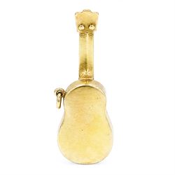 Two gold pendants / charms including 17ct guitar and a 9ct articulated lady in a shoe, London 1964