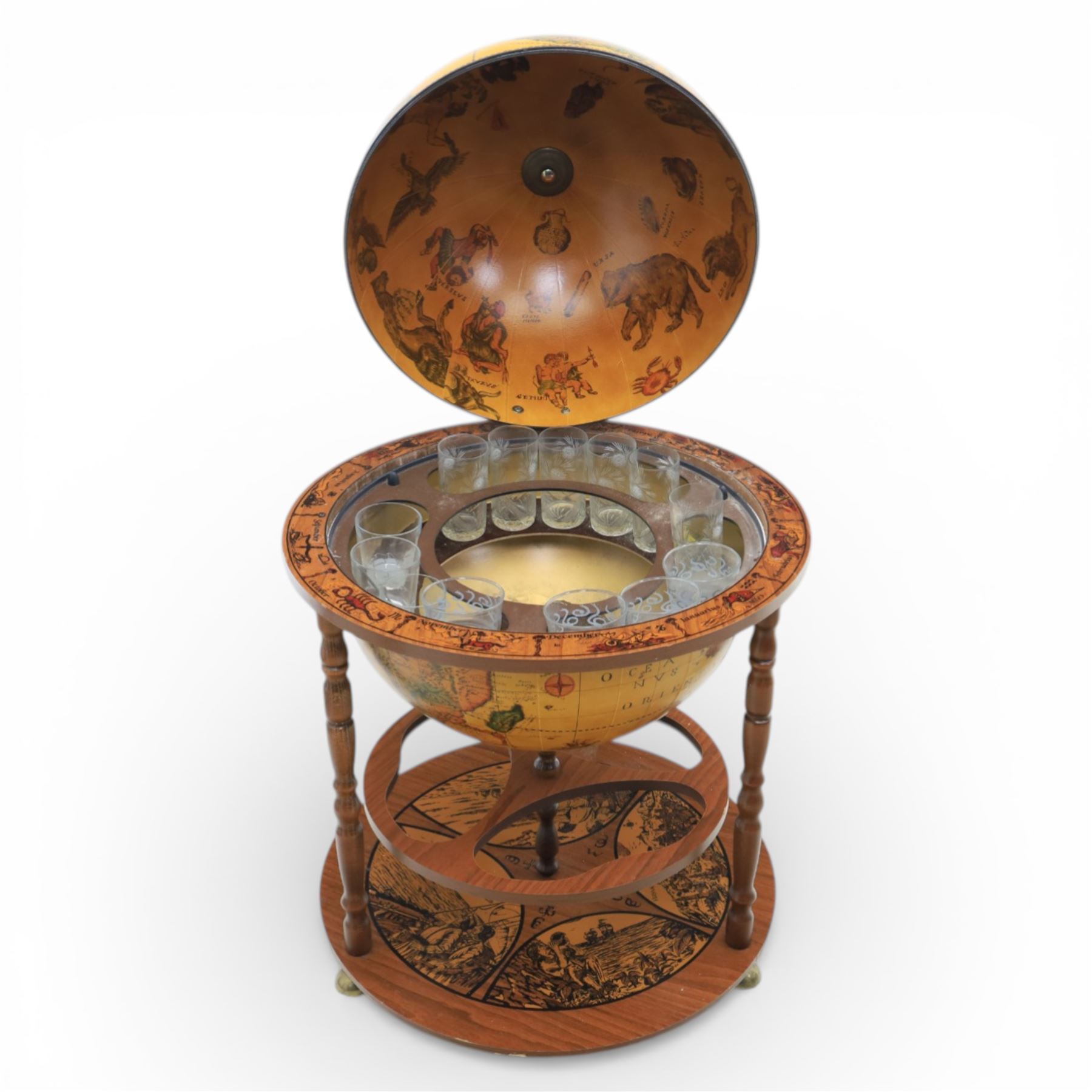Late 20th century drinks globe, with lift off top with rotating inside with apertures for bottles, raised on brass castors