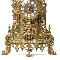 19th century design mantel clock, the brass dial with porcelain numerals, bell strike in brass case of rococo design with urn finial H60cm