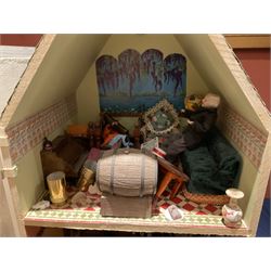 Seagull Pub - scratch-built wooden doll's house as a two-storey gable fronted public house painted in white green and maroon; the hinged front with ground floor veranda and window over opening to reveal two fully furnished rooms with dog-leg staircase and well stocked bar with bar-tender L31cm H62cm D37cm; together with Corner Shop and Dollies Pantry; a similarly painted scratch-built wooden two-storey flat-roofed doll's house as a well stocked ground floor grocery shop with stairs up to two further fully furnished rooms and more stairs giving access to a roof terrace L46cm H57cm D33cm (2)