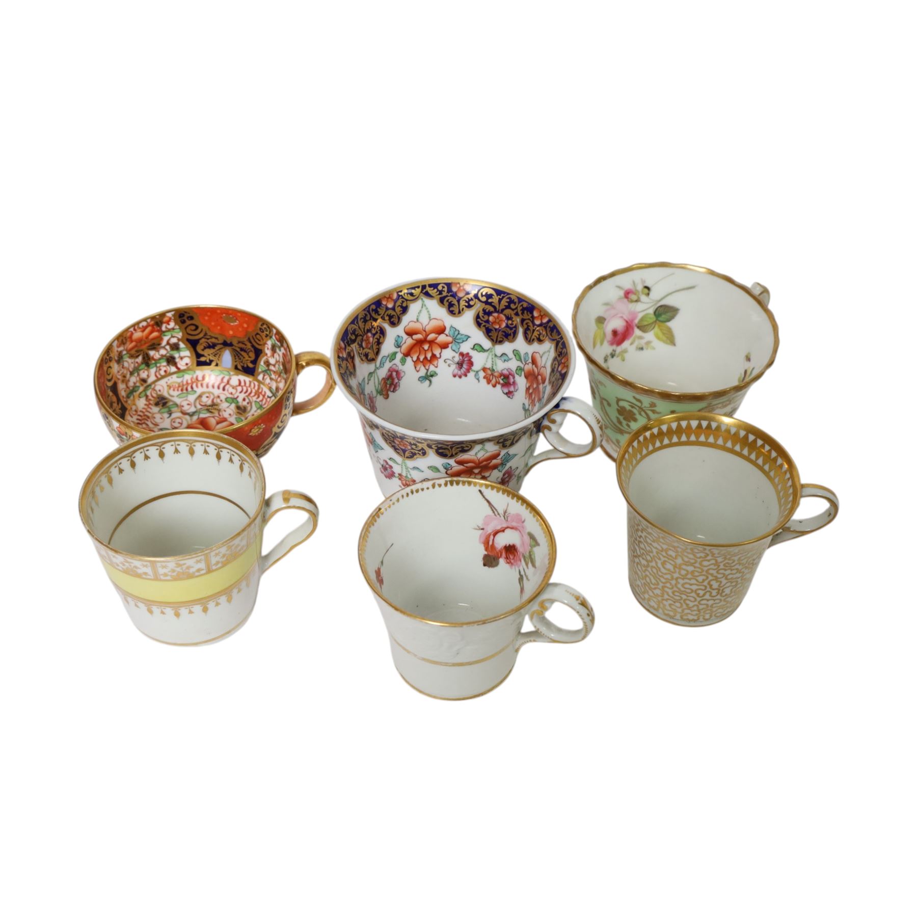 Group of 19th century tea and coffee wares, comprising two Davenport Imari 3545 pattern tea cups and saucer, one example upon three stylised bun feet, H5.5cm, a pair of Chamberlain's Worcester cabinet cups and saucers, hand painted with reserves of floral sprays and sprigs against an apple green ground, H7cm, a large size Chamberlain's Worcester cup and saucer with Imari type decoration and cobalt blue band to rim, H7.5cm, Chamberlain's Worcester cup and saucer with moulded floral band detail, and two further cups