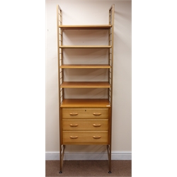  Staples Laddarax teak wall unit, gold painted metal frame, chest with three drawers, four shelves, W64cm, H202cm, D41cm  