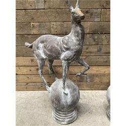 Pair of cast iron garden Stag figures or gate finials, raised on spherical ribbed base 