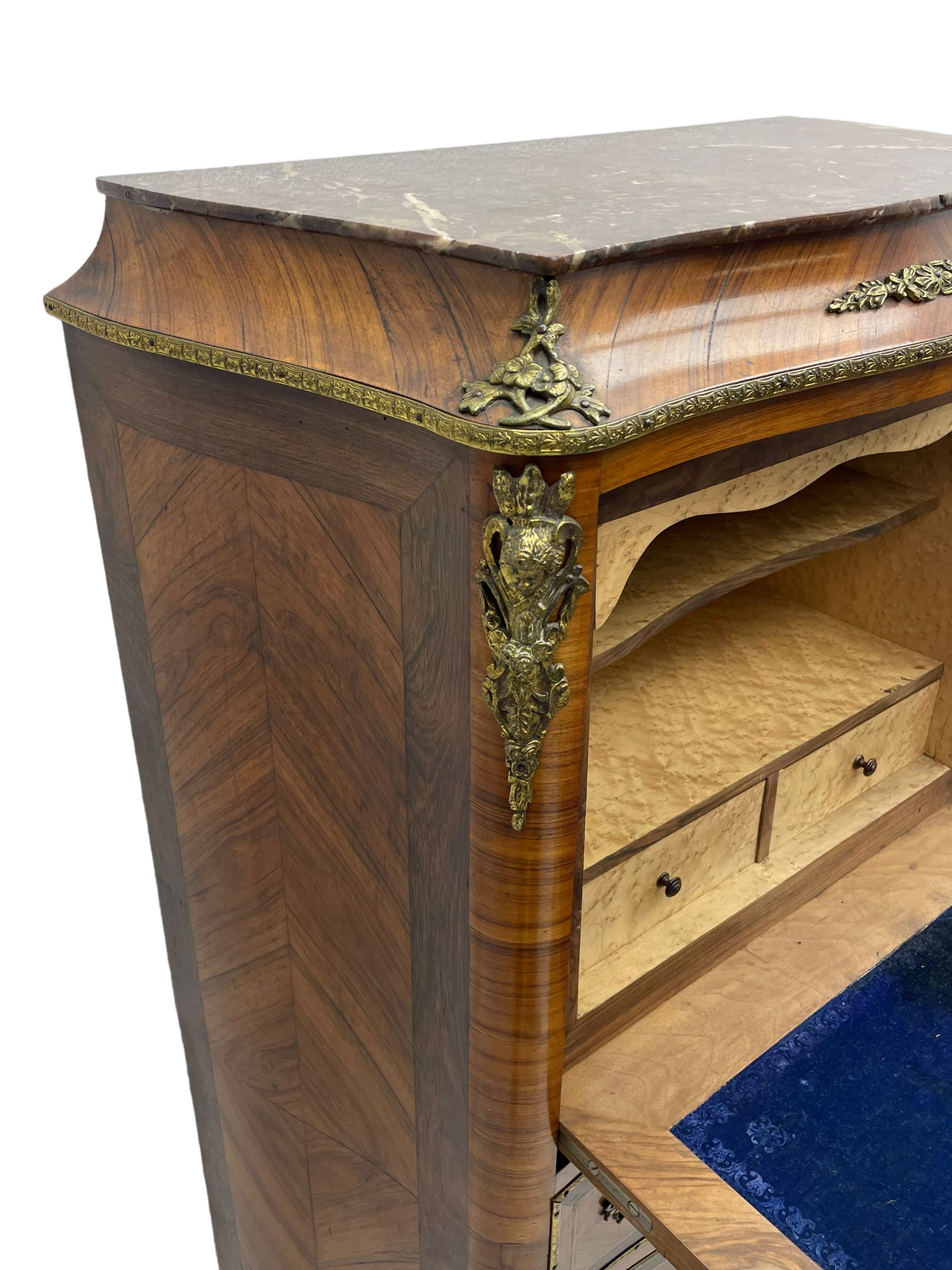 Mid-20th century Louis XVI design Kingwood and walnut secretaire à Abattant, shaped serpentine form with dark rouge variegated marble top, the fall front disguised as three drawers enclosing birdseye maple interior with shelf, drawers and writing surface, four functioning drawers below, decorated with cast gilt metal mouldings and mask cartouches, on skirted base with egg and dart moulded gilt metal edge