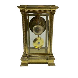 Late 19th century French brass four glass mantle clock by Samuel Marti of Paris, c1880 case on a recessed stepped plinth with four twisted columns and Corinthian capitals to the four corners, with a two- part enamel dial, Roman numerals and minute markers, non matching steel hands and visible Brocot escapement with cornelian pallets, 8-day rack striking movement stamped “Medaille de bronze” with chamfered pendulum bob and key.