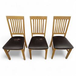 Contemporary set of six light oak dining chairs with faux leather cushion seats 