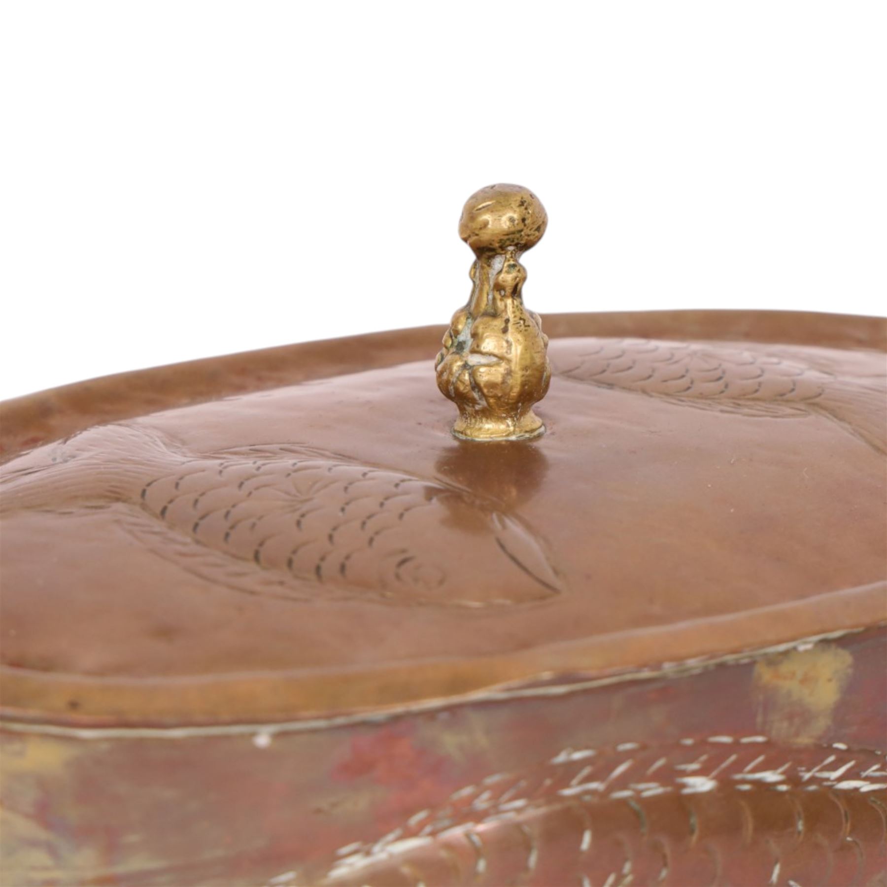Copper twined handled poaching dish, decorated with fish to the sides and lid, H16cm