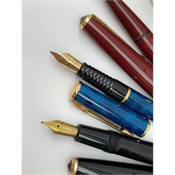 A group of four fountain pens, comprising Parker Duofold, nib marked 14K, Swan Mabbie Todd & Co Ltd Self Filler, nib marked 14C 585, Conway 57, nib marked 14ct, and Waterman Laureat. 