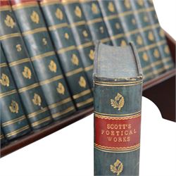 Edwardian book trough, the serpentine ends with boxwood stringing, pierced foliate keyhole shaped detail, and integrated shaped supports, housing Scott, Sir Walter, Poetical Works, Edinburgh, 1868, 12 vols, book trough 18.5cm x 38cm x 22.5cm
