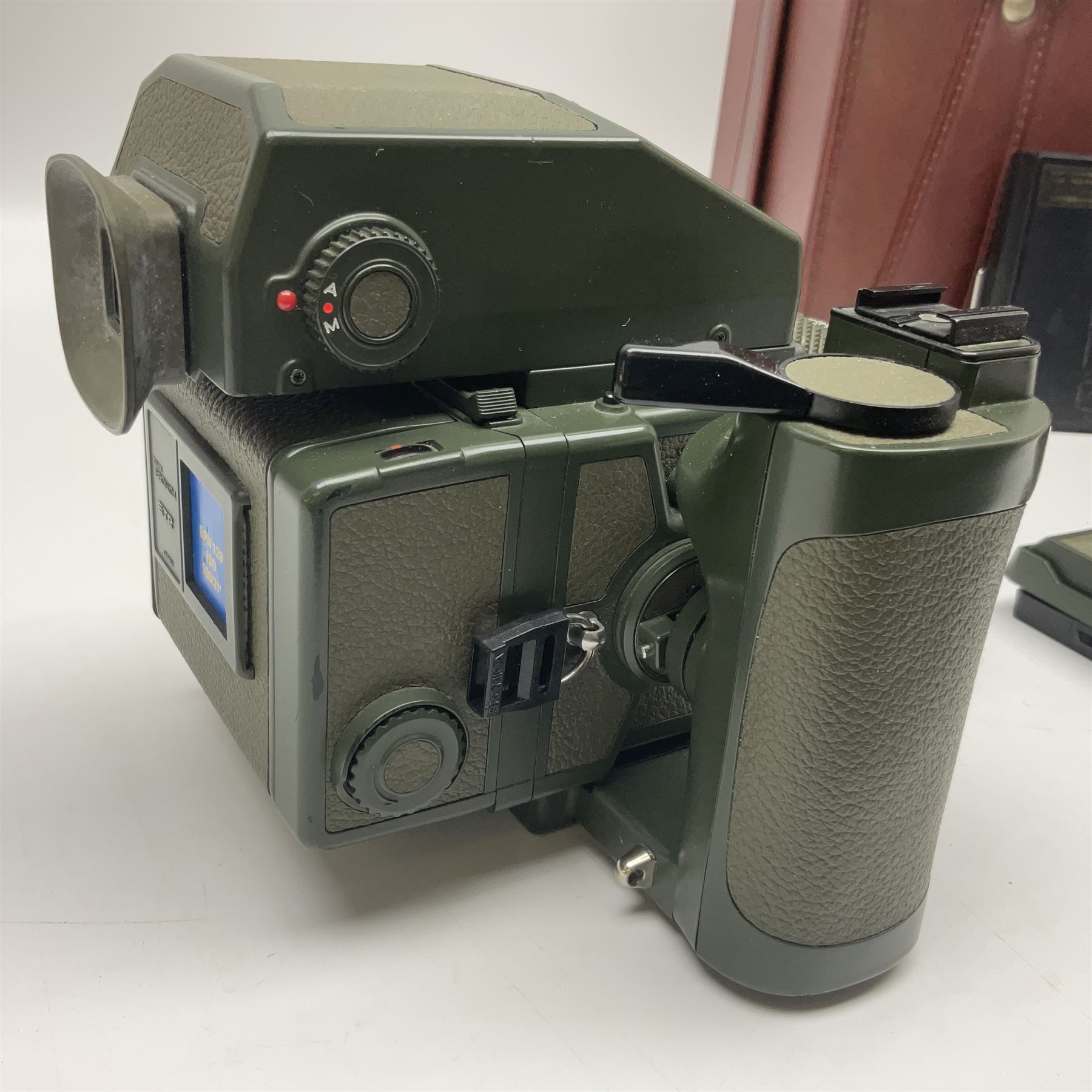 Zenza Bronica ETRS camera body, safari edition, serial no. 7100811, with 'Zenza Bronica Zenzanon EII 1:2.8 f=75mm' lens, serial no. 7908591, film magazine back, safari, serial no. 8100564, AE-ii metering head, safari, serial no. 617024, etc, all in leather case