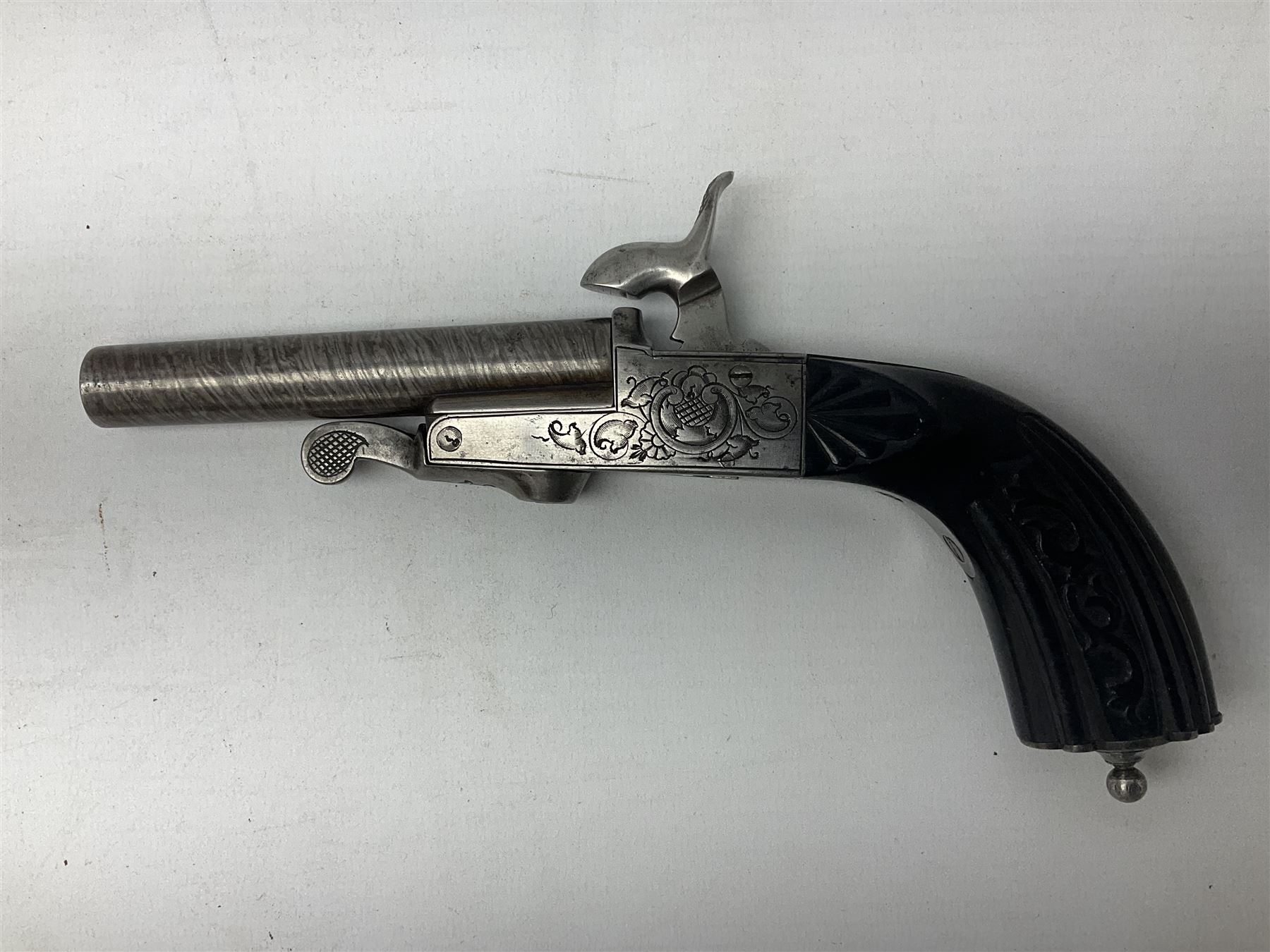 Mid-19th century French Boissy 12mm single barrel pin-fire pistol, the 9.5cm rifled barrel with brown stub twist damascus decoration, side screw under lever opening and English proof marks, retailed by H. Akrill Beverley, chased action with drop-down trigger and carved walnut stock L21cm