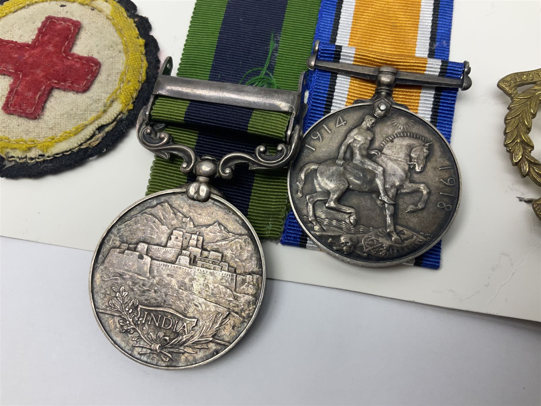 George V India General Service Medal with Afghanistan N.W.F. 1919 clasp and WW1 British War Medal awarded to 79561 Pte. R.D. Rowbottom R.A.M.C.; both with ribbons; card mounted with cap badge and Medical Corps cloth badge