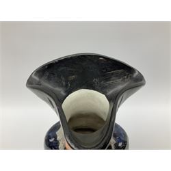 Early 20th century Staffordshire William Kent Squire toby jug, modelled seated upon a corner chair holding a jug of ale in his right hand, H28cm