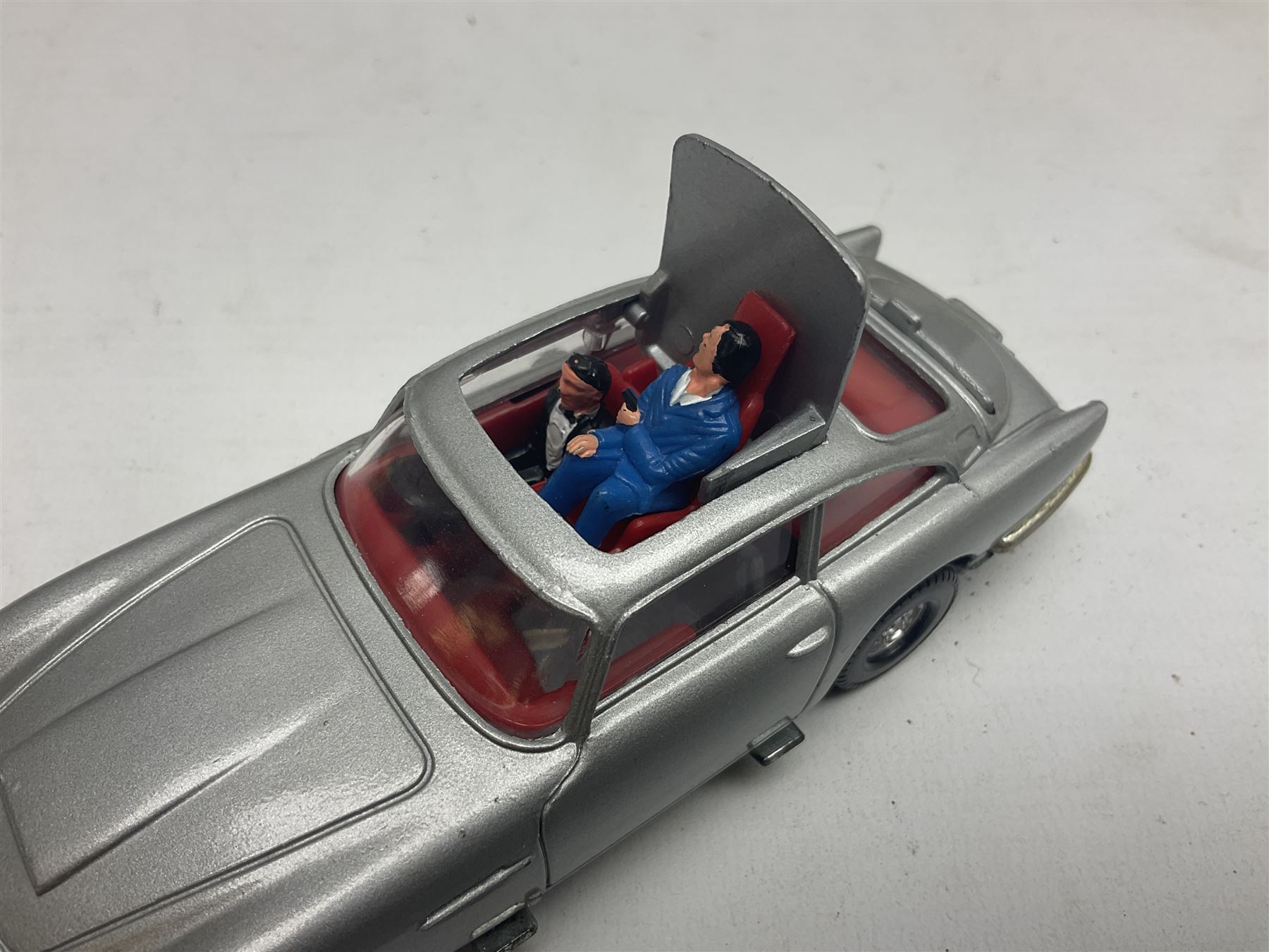 Corgi - die-cast model of James Bond Aston Martin DB5 No.271 with silver body and red interior, gold bumpers and four-spoke wheels, James Bond and two bandit figures; original window box with header card; and Dinky Shado 2 Mobile with one missile No.353; in window box (2)