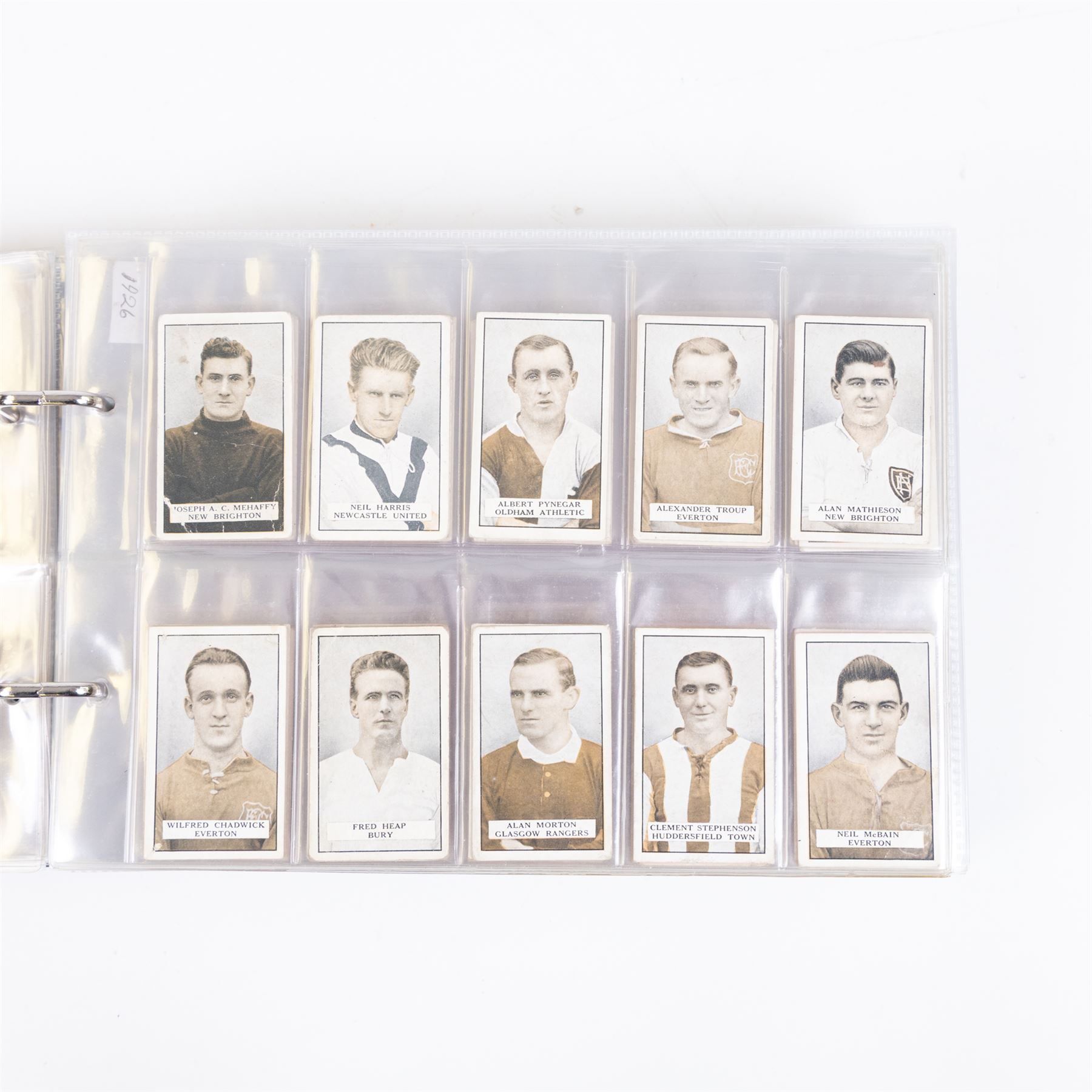 Collection of Edwardian and later Football related trading and cigarette cards, including forty-nine of fifty 1906 Ogden's Football Club Colours, 1922 PALS Footall series, ninety of one hundred 1925 Gallaher Famous Footballers, complete set of forty-four 1926 Ogden's Captains of Association Football Clubs and Colours, complete set of fifty 1927 Players Football Caricatures by MAC,  complete set of fifty 1927 Players Football Caricatures by RIP,  complete set of fifty 1930 Players Association Cup Winners, complete set of 50 1933 Ogdens AFC Nicknames etc, housed in brown cigarette card album
