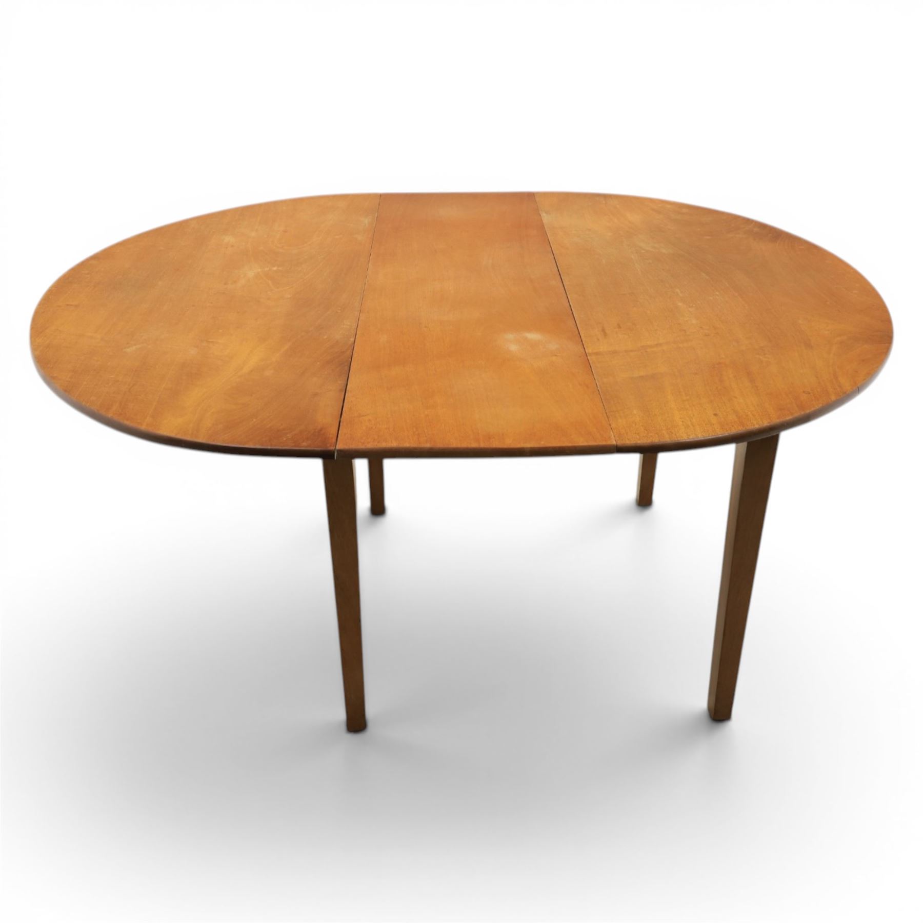 Mid 20th century teak extending dining table, together with eight teak chairs with green leather seats, extends to 154cm