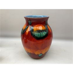 Collection of Poole Pottery, comprising charger and vase in Volcano pattern and a duck figure in a similar pattern 