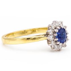 18ct gold sapphire and diamond cluster ring, single oval cut sapphire of approx 0.45 carat, surrounded by twelve round brilliant cut diamonds, London 1998, total diamond weight approx 0.25 carat