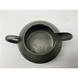 Liberty & Co Tudric pewter three piece tea service, comprising teapot with woven reed handle, twin handled open sucrier, and milk jug, each of squat form with planished finish, each impressed beneath Tudric Pewter Ware 01537 Made in England, together with a matched unmarked tray