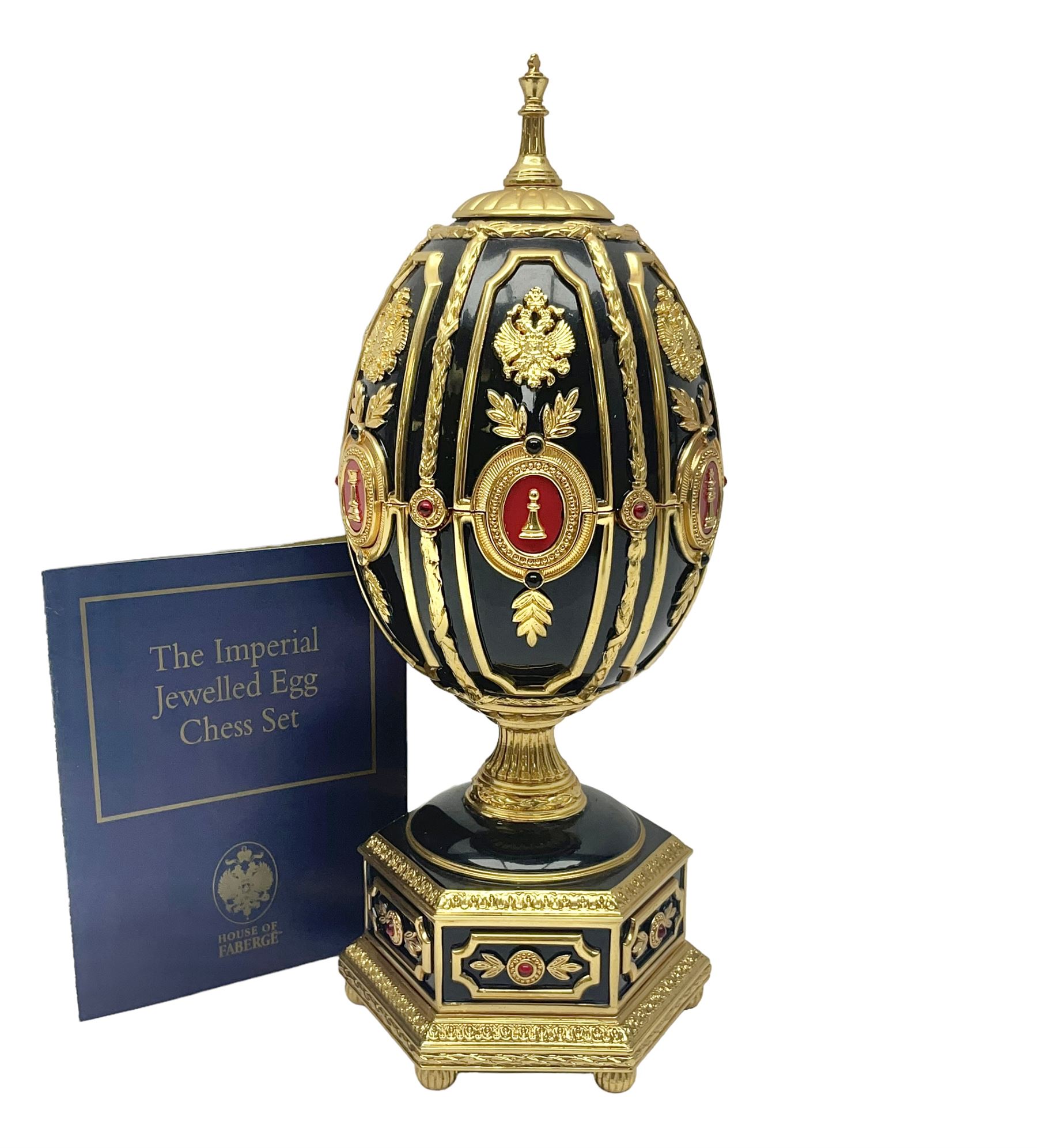 Franklin Mint House of Faberge; The Imperial Jeweled Egg Chess set, the egg opening to reveal a chess board, with a draw to the hexagonal base holding the miniature chess pieces, H23cm 