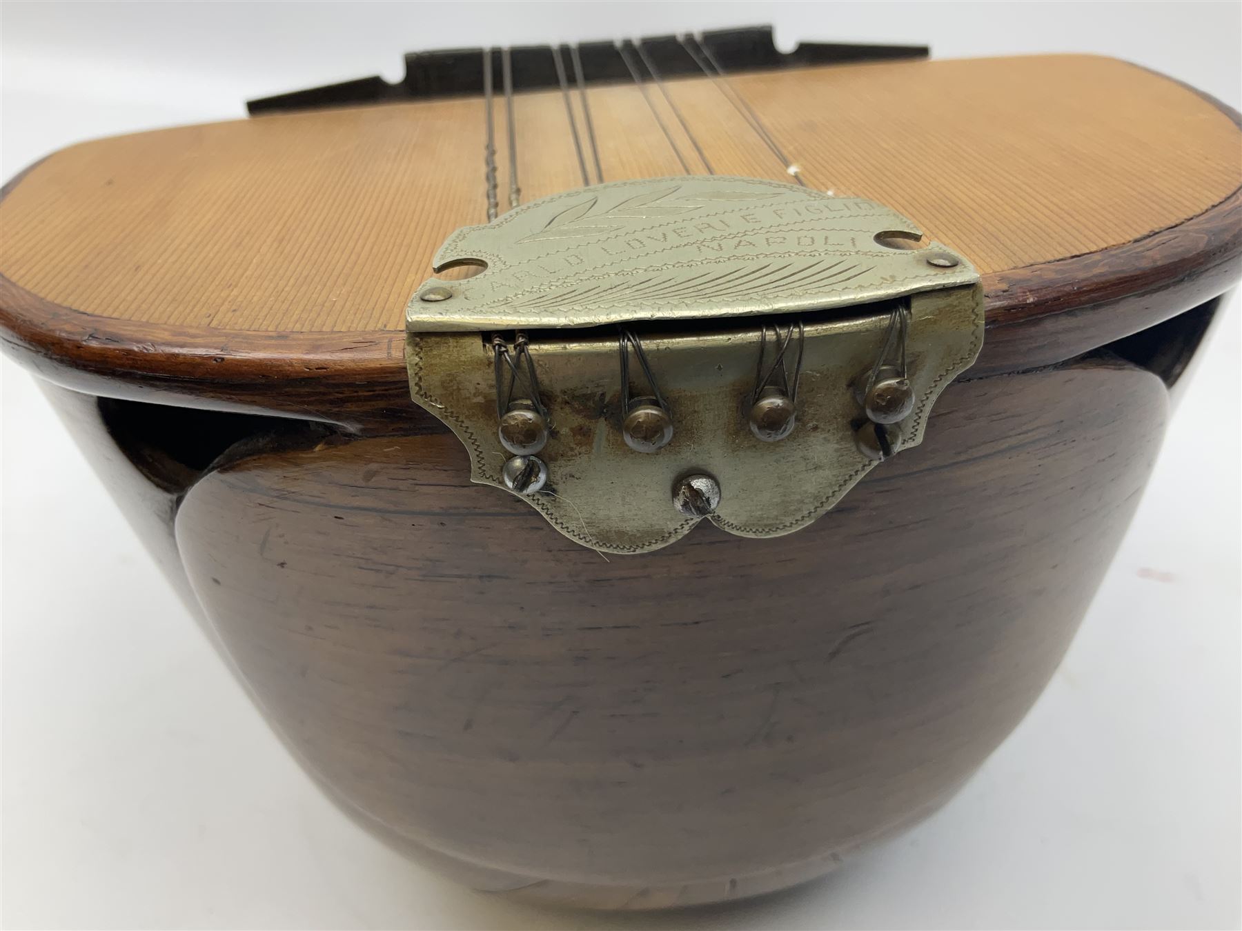 Italian mandolin, with foliate inlaid scratchplate, paper label inscribed 'Carlo Loveri & Figlio of Napoli', L62cm