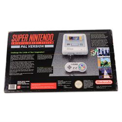 Super Nintendo Entertainment System Pal Version, comprising Super NES Control Deck, Super Mario World Game Pack, two controllers, aerial switch box and AC adapter, boxed