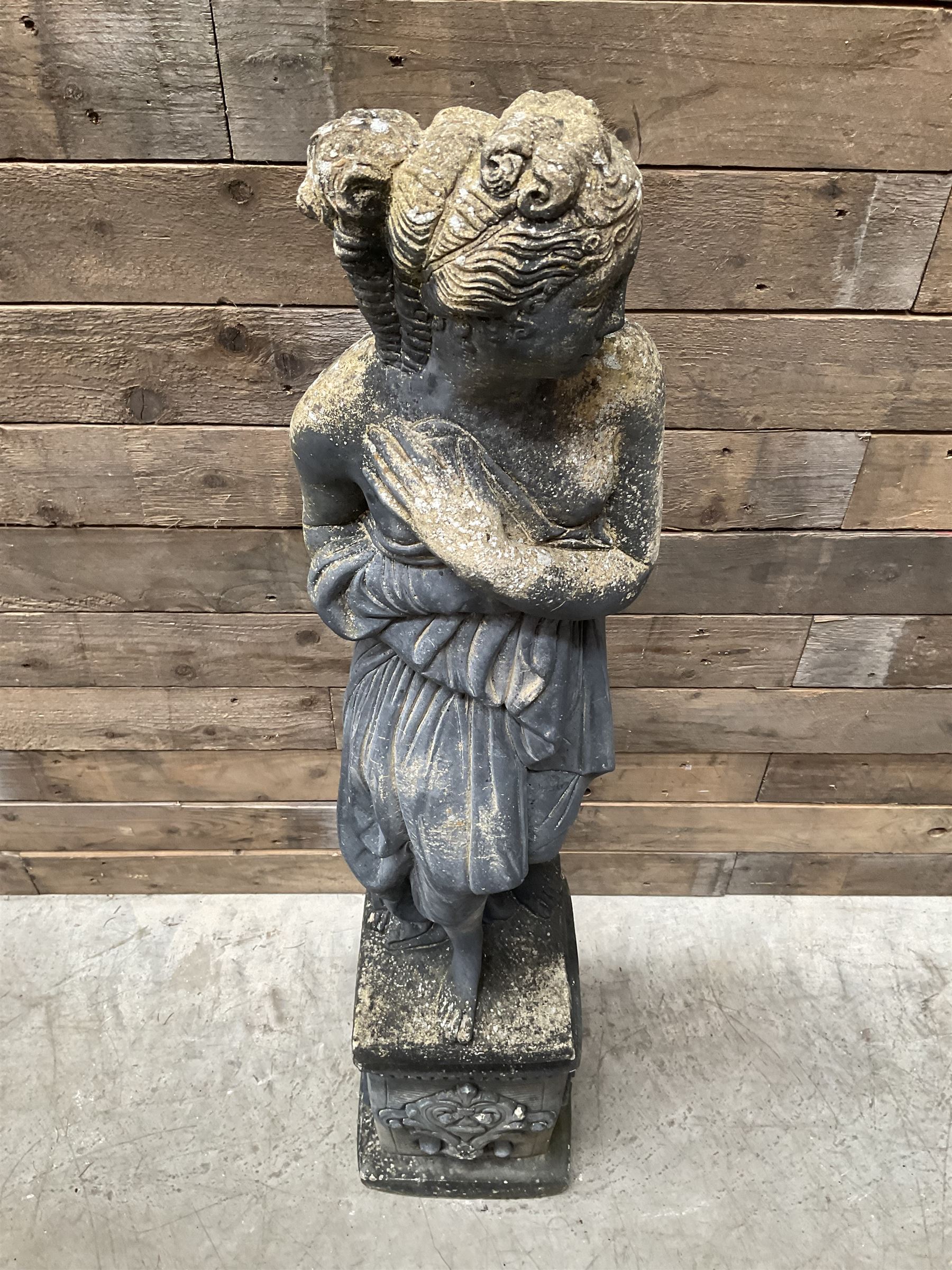 Cast stone weathered garden statue of Venus on pedestal