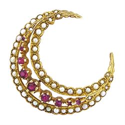 9ct gold ruby and split pearl crescent moon brooch, set with a row of nine graduating roun...