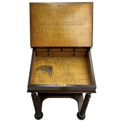 Victorian walnut Davenport, hinged sloping top with inset leather writing surface, enclosing satinwood lined interior with two drawers over faux drawer, fitted with inkwell drawer and pen compartment to the side over four drawers with an opposing false set, raised on spiral turned supports united by a shaped platform base