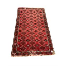 Turkish red ground rug, geometric patterned field, repeating border 