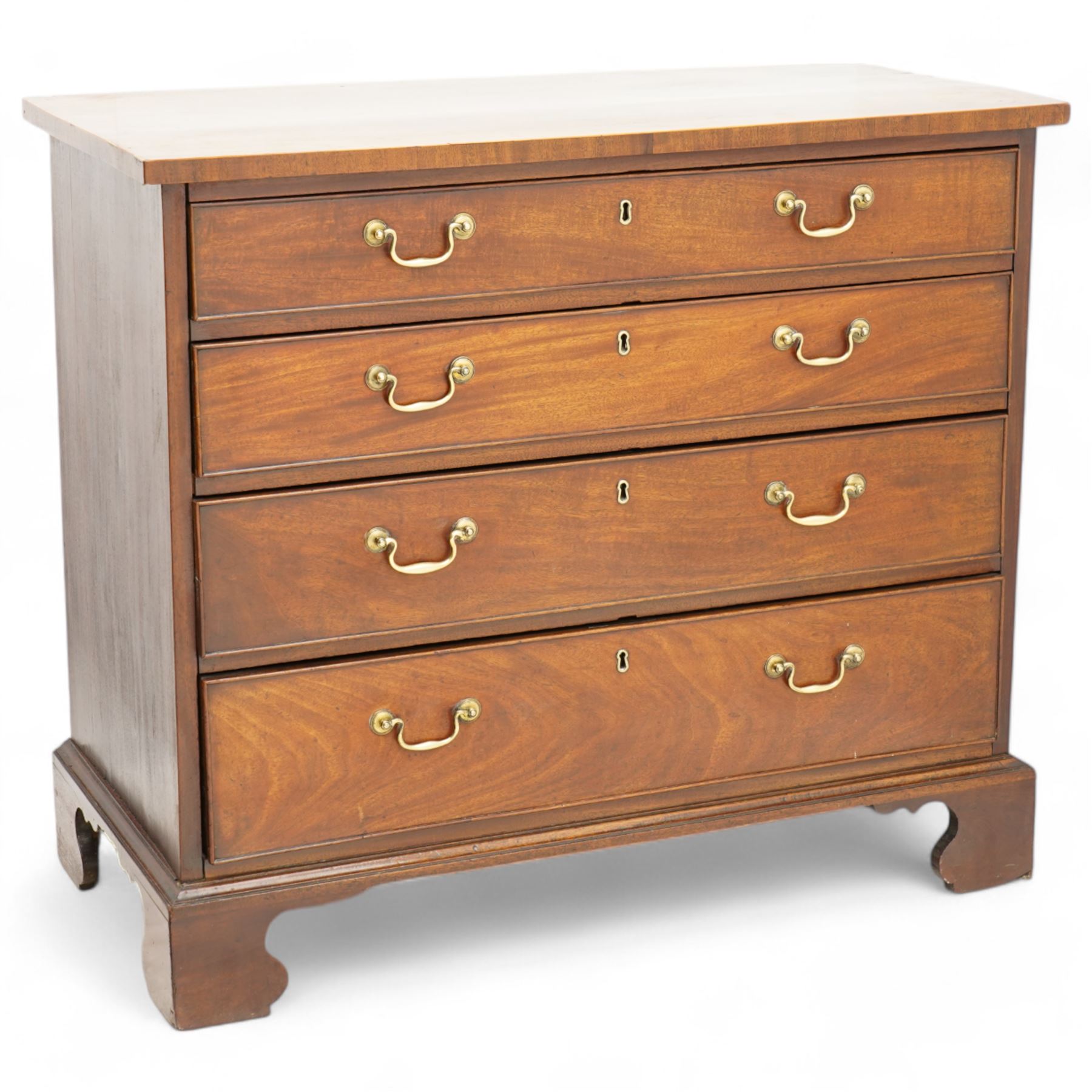 George III mahogany chest, rectangular top over four long cock-beaded drawers, fitted with brass swan neck handles and circular plates, lower moulding over bracket feet 