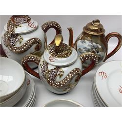 Japanese Kutani China tea service, comprising two teapots, six teacups and saucers and six side plates, the teapot handles and finials decorated in relief with dragons, the bodies decorated with gilt dragon decoration, together with other Japanese ceramics