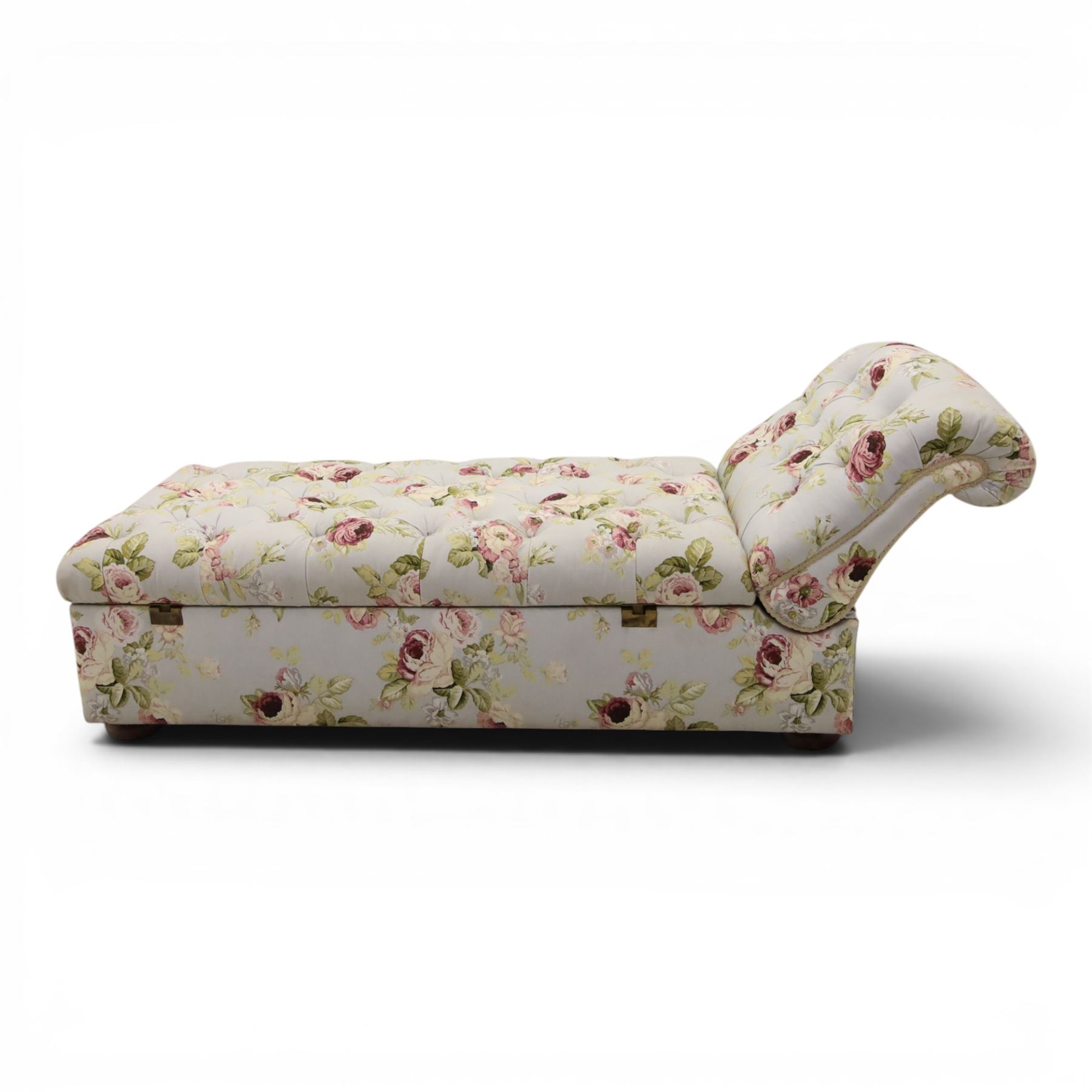 Traditional design scroll end chaise longue Ottoman, floral upholstered buttoned seat hinged to reveal a red lined interior, with reclining scroll end, raised upon squat bun feet