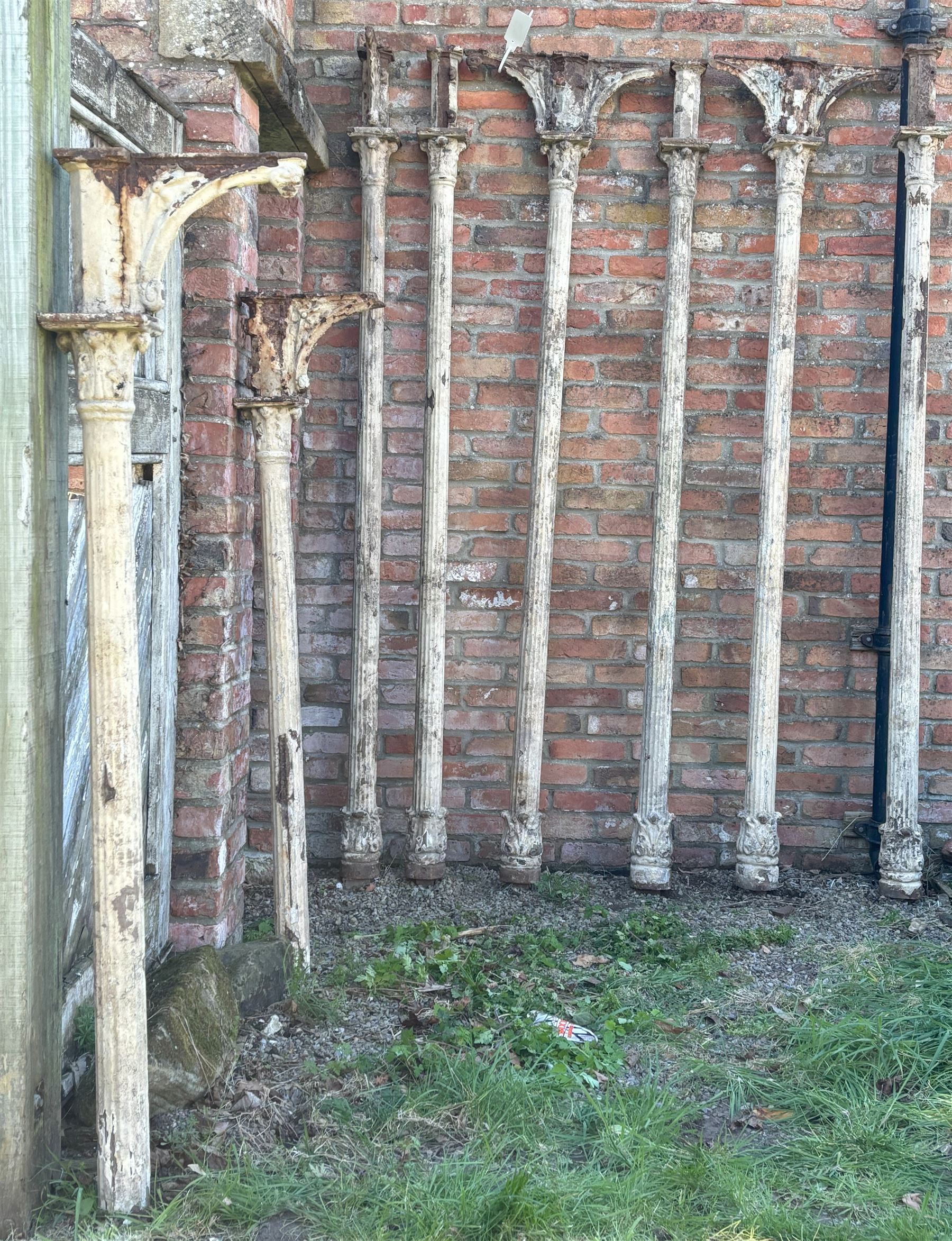 Set of eight Victorian cast iron reclaimed architectural columns, removed from a small gauge railway station, each highly detailed with acanthus cast capitals above fluted columns, six having further acanthus to base. H242cm / 160cm.  - COLLECTION BY APPOINTMENT FROM: The White House, Thirsk Road, Easingwold, York, YO61 3NF - CALL 01723 507111 TO ARRANGE