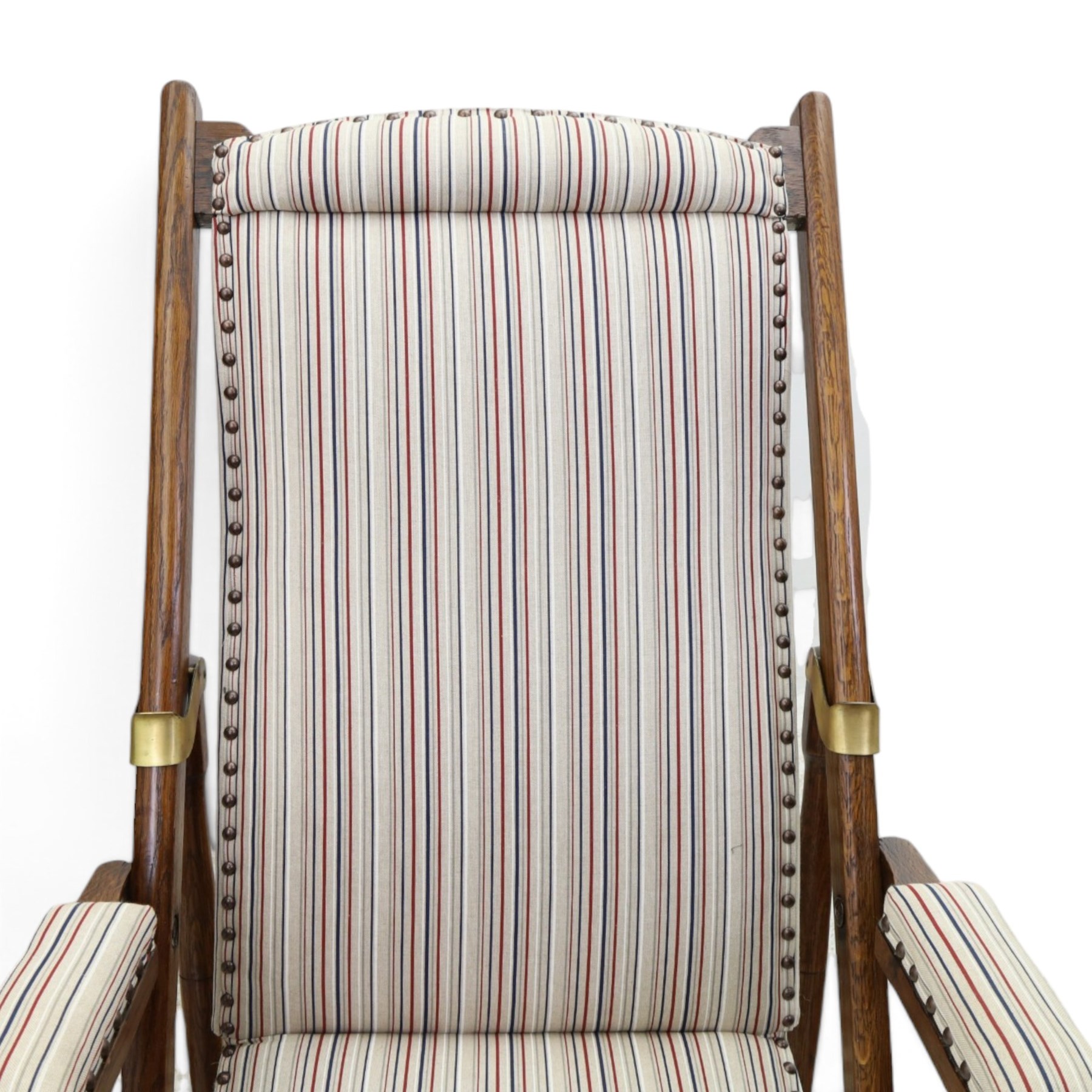 Pair of early 20th century oak framed garden reclining and folding deckchairs, high back and seat upholstered in striped fabric with padded armrests