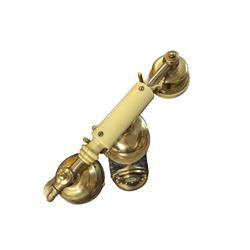 Tall Eastern brass and marble telephone, H105cm