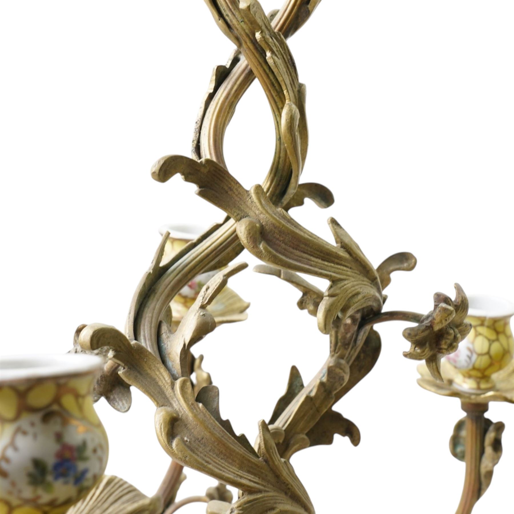 Rococo design brass ten light chandelier with scroll branches and ceramic candle holders H74cm