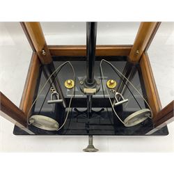 Set of laboratory balance scales by Reynolds & Branson of Leeds in fully glazed mahogany case with rise-and-fall front door, black vitrolite base with brass feet and hand cranked action L40cm H51.5cm D30cm; and bakelite cased set of brass weights