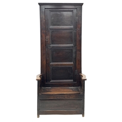 Early 18th century country oak bacon settle, tall raised cupboard back enclosed by paneled door, box seat with hinged lid, field paneled front, W87cm, H198cm, D65cm