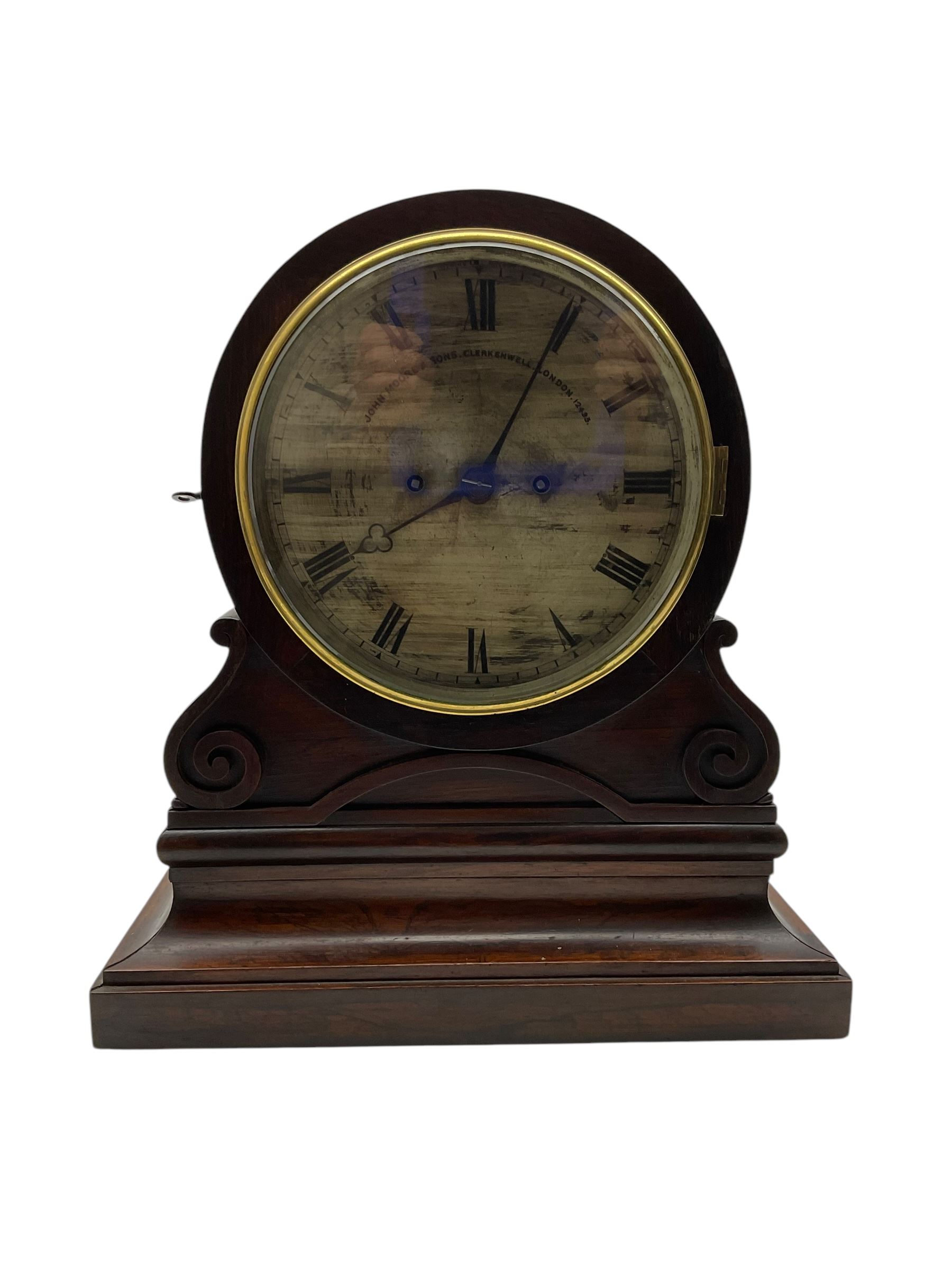 John Moore & Sons of Clerkenwell, London- late 19th century 8-day twin fusee mantle clock in a rosewood circular drum case raised on an ogee scroll support and broad plinth, rear door with silk backed fretwork (detached),  8