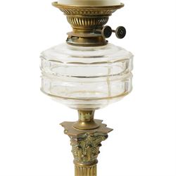 Pair of Victorian table oil lamps with clear glass reservoirs on brass Corinthian columns and stepped square bases with chimneys and etched glass shades H71cm overall
