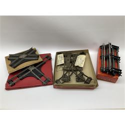 Hornby '0' gauge - layout accessories comprising PR1/PL1 Points, CR1 Right Angle Crossing and CA2 Acute Angle Crossing, all boxed; tin-plate signal box; tin-plate level crossing; textured wooden tunnel, possibly pre-WW2; and quantity of track, some boxed; together with '00' gauge tin-plate station