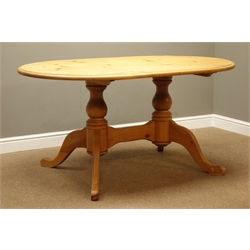  Oval solid pine dining table on twin pillar base on splay supports, 147cm x 98cm, H75cm  