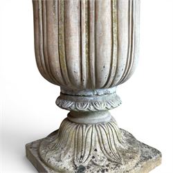 Cast stone tulip urn, petal rim with bell shaped bowl on squat base, stamped HGC; with associated plinth (2)