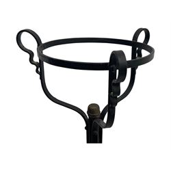 Late 19th century wrought iron and brass pulpit lamp, featuring an adjustable stem with a spiral twist detail, brass foliate mounts, and a tripod base with scrolled feet and decorative floral accents