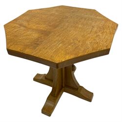 Mouseman - oak coffee table, octagonal adzed top on cruciform base, sledge feet, by the workshop of Robert Thompson, Kilburn
