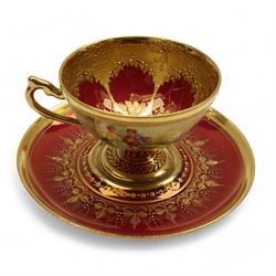 Four early 19th century Dresden cups and saucers, comprising twin handled chocolate cup and cover, decorated with floral swags, cup and saucer decorated with children dancing and two others 