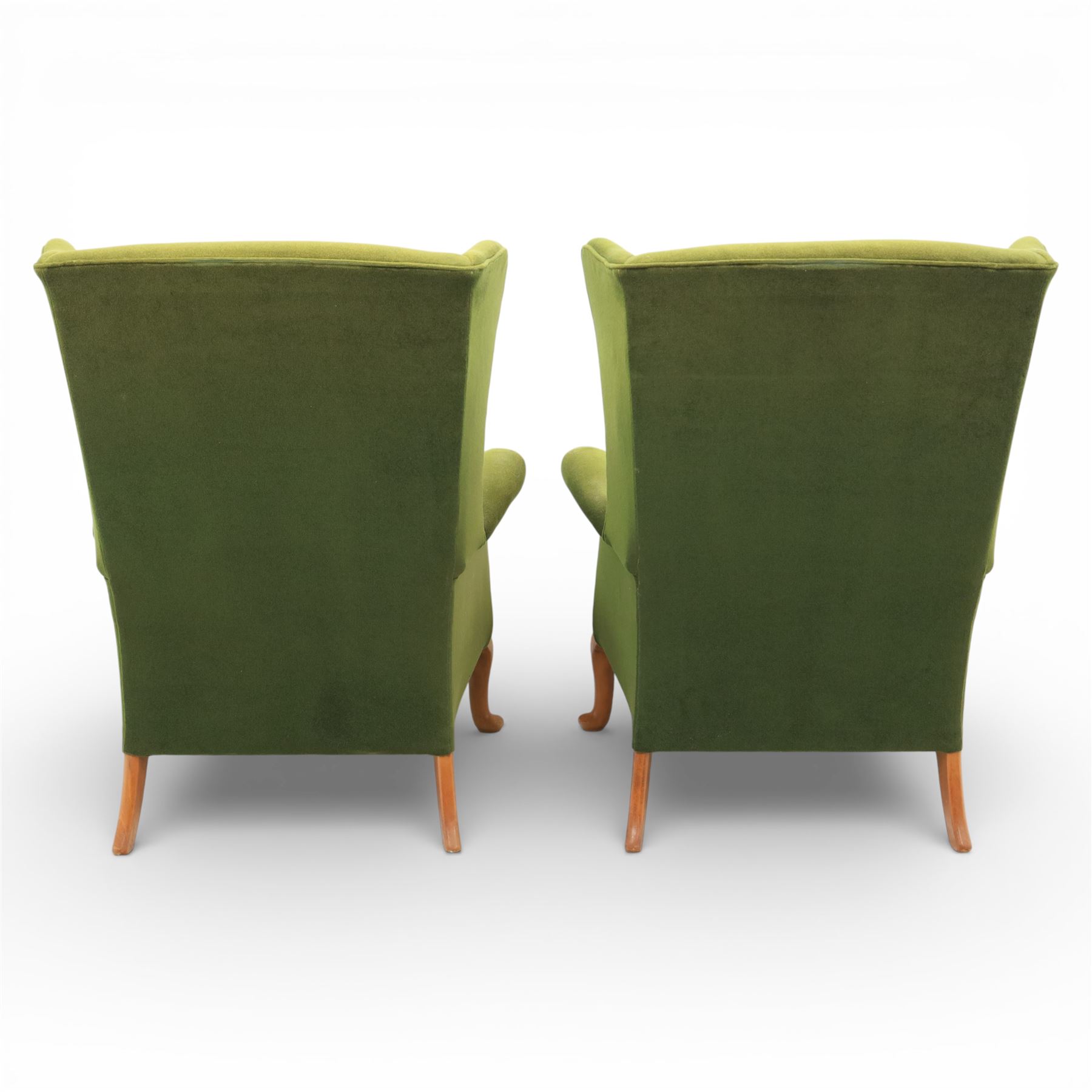 Parker Knoll - pair of 'Penhurst' wingback armchairs upholstered in olive green fabric, on light stained supports 